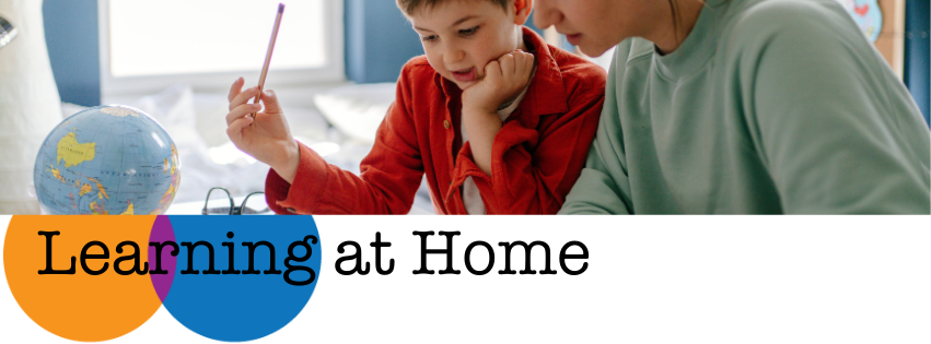 Learning at Home banner; young child with pencil and globe on table with parent reading; orange and blue circle with Learning at Home text